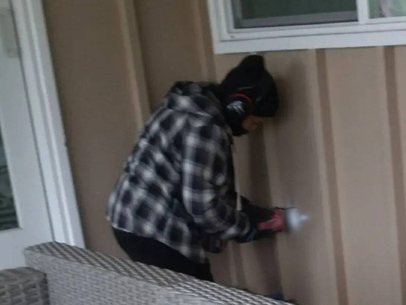 Professional electrician installing an exterior outlet in Fort Edward