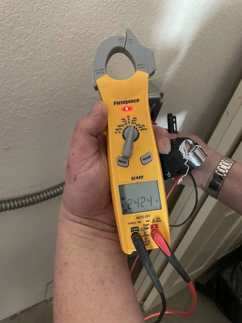 Voltage testing with clamp meter during Circuit Breaker Repair in Fort Edward